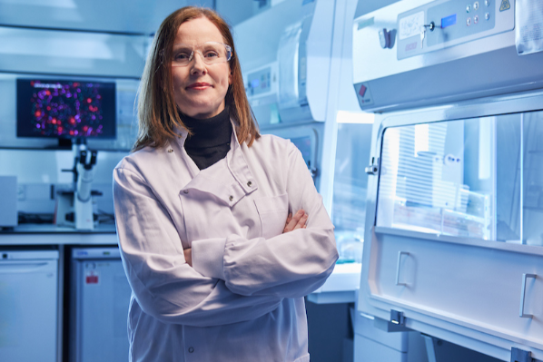 Female researcher standing in lab